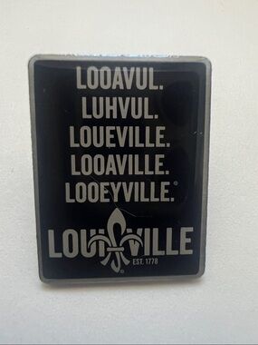 Louisville lapel pin features popular phonetic mispronunciations of "Louisville”